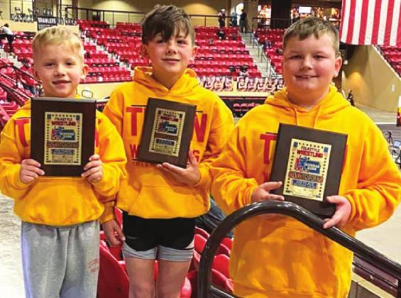 Members of the Columbus Wrestling Club eight and under squad placed in the USAWKS 2021 State Folkstyle Wrestling Championship in Mulvane, Saturday. Baylor Bowman placed fourth in the 8U, 43-pound class, Cam Carter was sixth at 8U, 61-pound class and Cajen Smith placed third in the 8U, 140-pound class. Courtesy Photo.