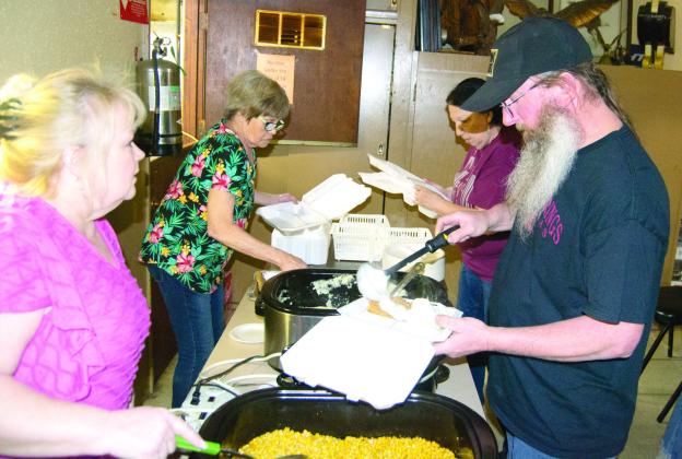 Janell Heath and Marcia Mallard serve the customers Anthony Swift and Beverly Lewellen. The fund raiser had a larger than expected turnout. The fundraiser was held for Ronald McDonald House. The group also took in a number of pop tabs for donation as well.